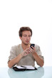 Man with cellphone and personal organizer