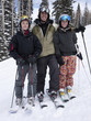Portrait of father and daughter skiing