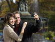 Photo: USA, New York City, Manhattan, Central Park, Mature couple photographing themselves in Central Park USA, New York City, Manhattan, Central Park, Mature couple photographing themselves in Central Park