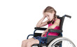 Photo: Very sad handicapped girl in a wheelchair over white background Very sad handicapped girl in a wheelchair over white background