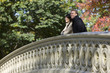 Photo: USA, New York City, Manhattan, Central Park, Mature couple standing on bridge in Central Park USA, New York City, Manhattan, Central Park, Mature couple standing on bridge in Central Park