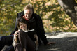 Photo: USA, New York City, Manhattan, Central Park, Mature couple reading book in Central Park USA, New York City, Manhattan, Central Park, Mature couple reading book in Central Park