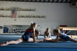 USA, Utah, Orem Girls (8-11) stretching in gym