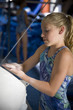 USA, Utah, Orem, girl (10-11) in gym applying talcum powder to hands