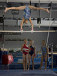 USA, Utah, Orem, girls (10-11) in gym watching friend exercising on pole
