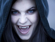 "USA, Utah, Cedar Hills, Portrait of female teenage vampire (16-17) wearing hood"