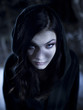 "USA, Utah, Cedar Hills, Portrait of female teenage vampire (16-17) wearing hood"