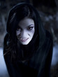 "USA, Utah, Cedar Hills, Portrait of female teenage vampire (16-17) wearing hood"