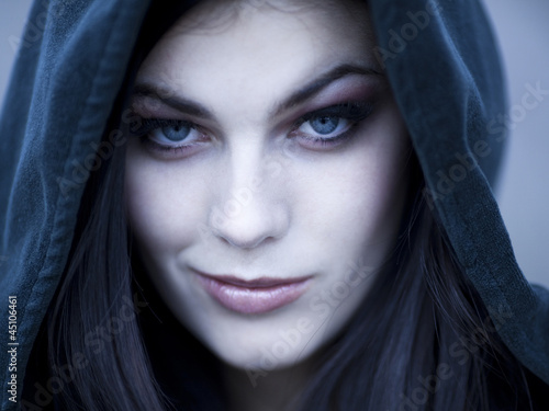 Photo: "USA, Utah, Cedar Hills, Portrait of female teenage vampire (16-17) wearing hood" "USA, Utah, Cedar Hills, Portrait of female teenage vampire (16-17) wearing hood"
