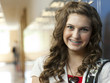 "USA, Utah, Portrait of teenage girl (14-15) in school corridor"