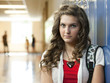 "USA, Utah, Portrait of teenage girl (14-15) in school corridor"