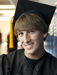 "USA, Utah, Spanish Fork, Portrait of male graduate student wearing mortar board"
