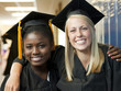 Photo: "USA, Utah, Spanish Fork, Portrait of two female graduate students (14-17) embracing" "USA, Utah, Spanish Fork, Portrait of two female graduate students (14-17) embracing"