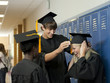 "USA, Utah, Spanish Fork, Three graduate students preparing for ceremony"