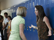 "USA, Utah, Spanish Fork, Two girls (16-17) arguing in school corridor"