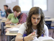 Photo: "USA, Utah, Spanish Fork, School girl (14-15) working in classroom" "USA, Utah, Spanish Fork, School girl (14-15) working in classroom"