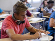 Photo: "USA, Utah, Spanish Fork, School boy (16-17) working in classroom" "USA, Utah, Spanish Fork, School boy (16-17) working in classroom"