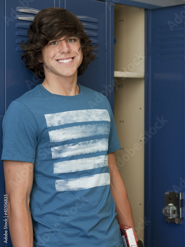 Photo: "USA, Utah, Spanish Fork, Portrait of school boy standing by lockers" "USA, Utah, Spanish Fork, Portrait of school boy standing by lockers"