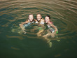 "USA, Utah, Lake Powell, Three women swimming in lake"