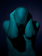 Young man with hands behind head