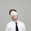 Studio portrait of young man with blindfold