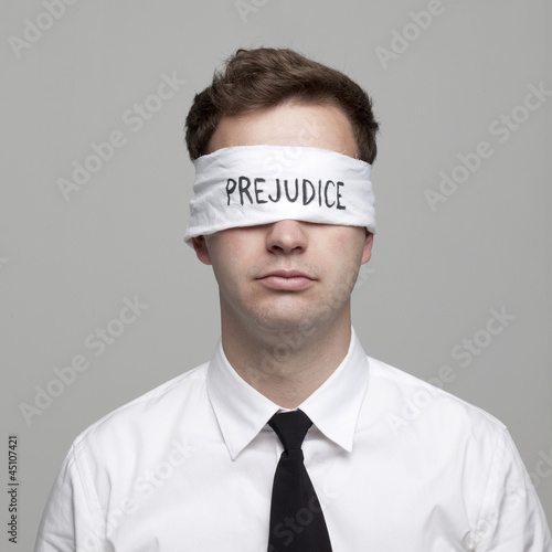 Photo: Studio portrait of young man with blindfold Studio portrait of young man with blindfold