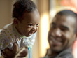 "USA, Utah, Cedar Hills, Father playing with baby boy (0-1 months)"