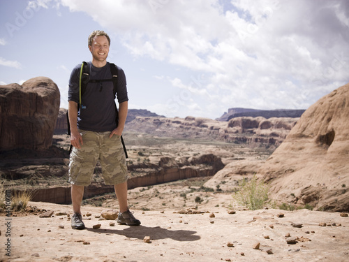 Photo: man on a hiking trip in the desert man on a hiking trip in the desert