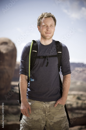 Photo: man on a hiking trip in the desert man on a hiking trip in the desert