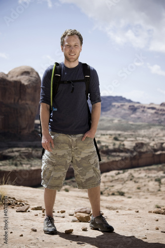 Photo: man on a hiking trip in the desert man on a hiking trip in the desert
