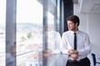 happy young business man at office