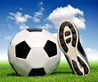 soccer ball and shoes in grass