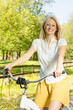 happy young woman on the bicycle