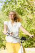 happy young woman on the bicycle