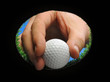 hand holding golf ball