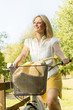 happy young woman on the bicycle