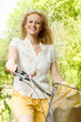 happy young woman on the bicycle