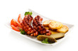 Grilled sausages, baked potatoes and vegetables