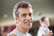 Man Holding Water Bottle In Health Club
