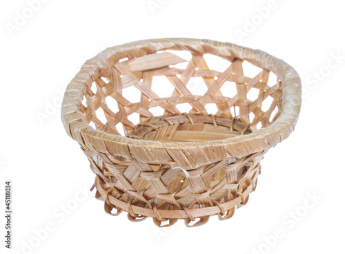 Photo: Wickerwork empty yellow breadbasket on white background Wickerwork empty yellow breadbasket on white background