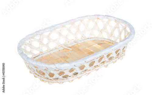 Photo: Wickerwork empty yellow breadbasket on white background Wickerwork empty yellow breadbasket on white background