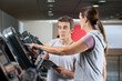 Woman Asking About Machines In Gym