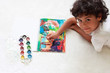 A cute little boy is drawing a picture