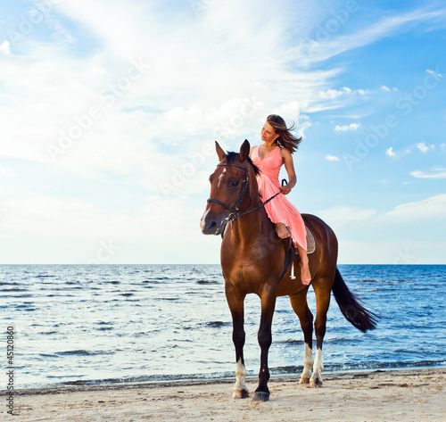 Photo: girl with horse on seacoast girl with horse on seacoast
