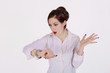 Photo: young businesswoman checks time on her wrist watch young businesswoman checks time on her wrist watch