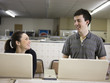 man and woman at a laundromat