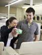 man and woman at a laundromat