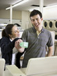 man and woman at a laundromat