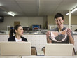 man and woman at a laundromat