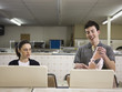 man and woman at a laundromat